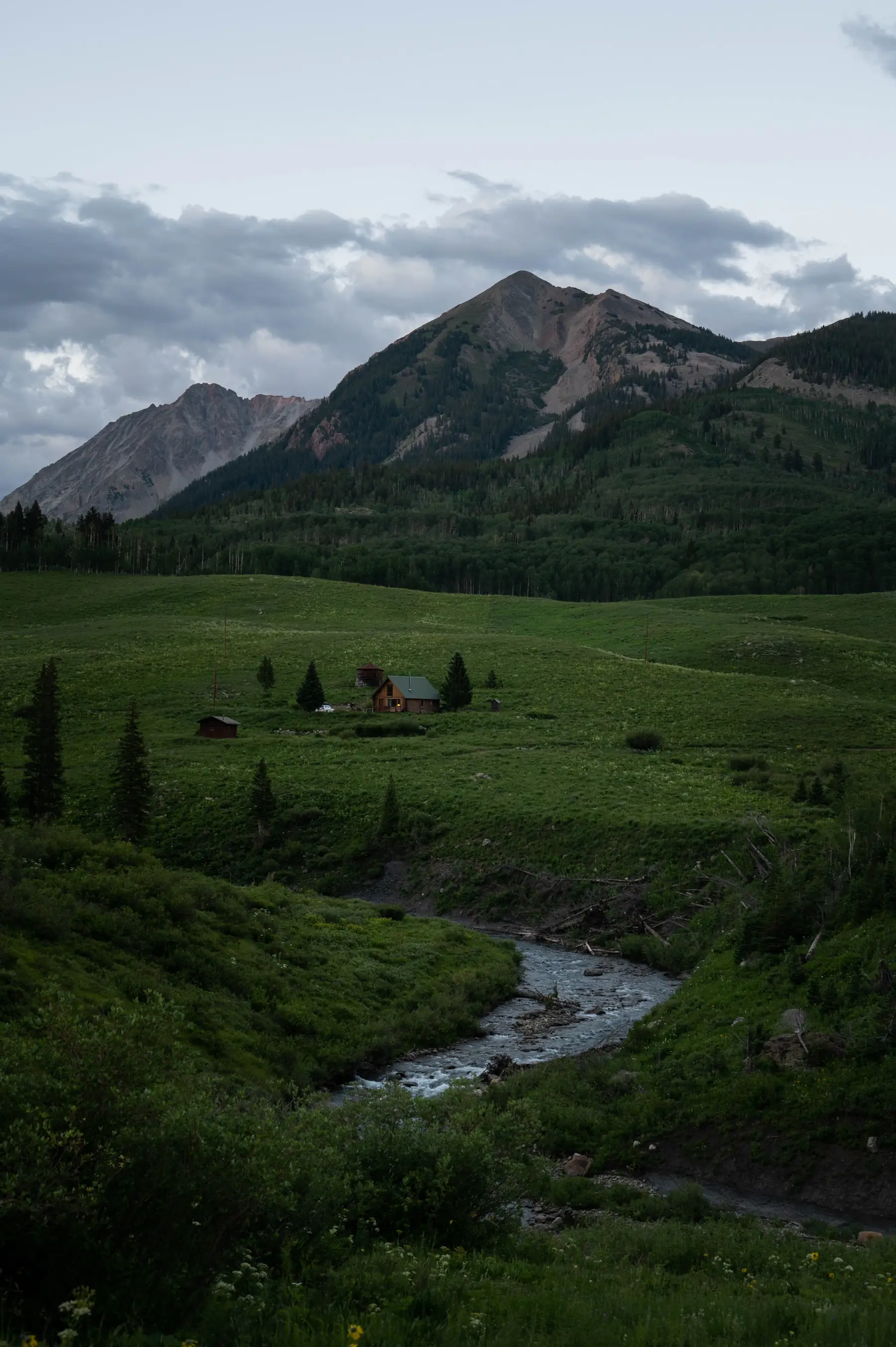 Small ranch house and cattle in a mountain valley